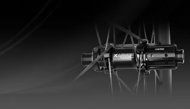 Carbon fiber wheelset hub detail showing carbon spokes and precision engineering
