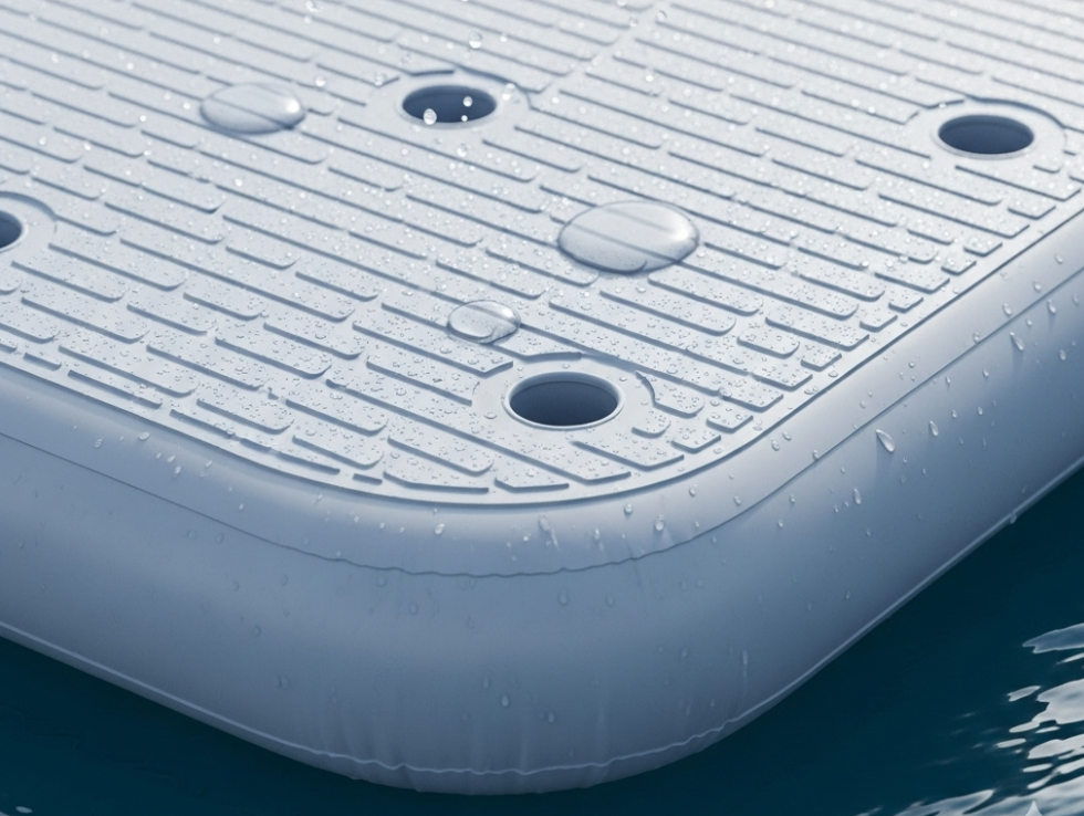 Inflatable swim platform with non-slip deck and drainage