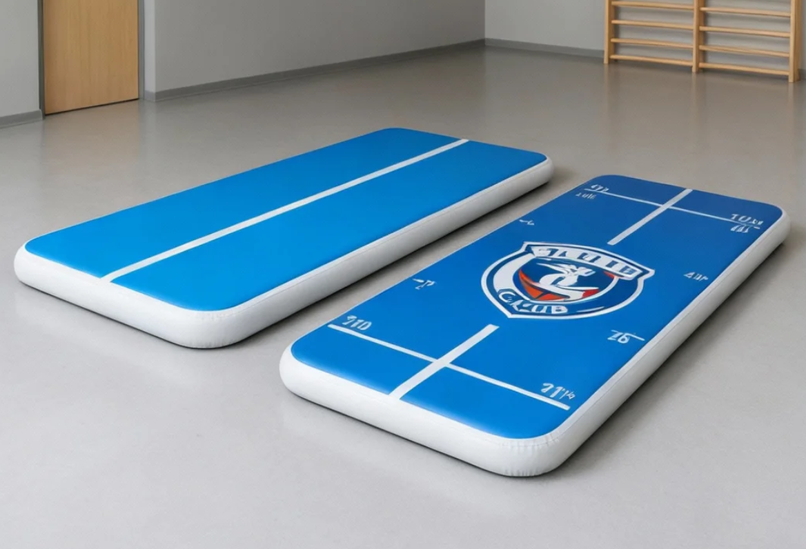 Custom gymnastics air mat comparison showing branding and specialized features for training schools