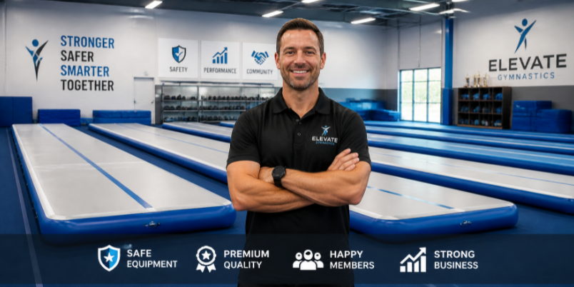 Confident gym owner standing in a well-equipped facility with perfectly arranged air tracks