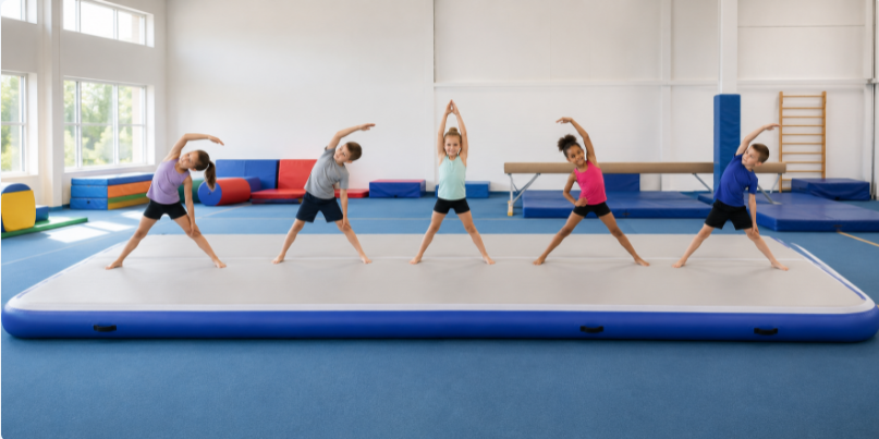 Group of students using a wide inflatable air floor mat