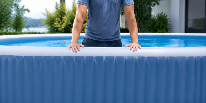 adult leaning on a rigid drop stitch pool wall without the wall bending or collapsing