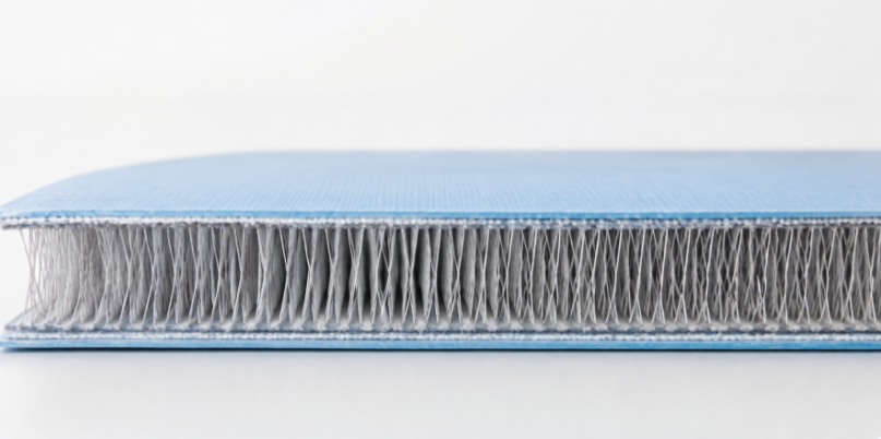 Cross-section of a drop-stitch pool floor showing the thread grid between two fabric layers