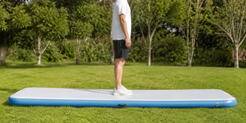 Person standing on a flat drop-stitch pool floor showing it stays rigid