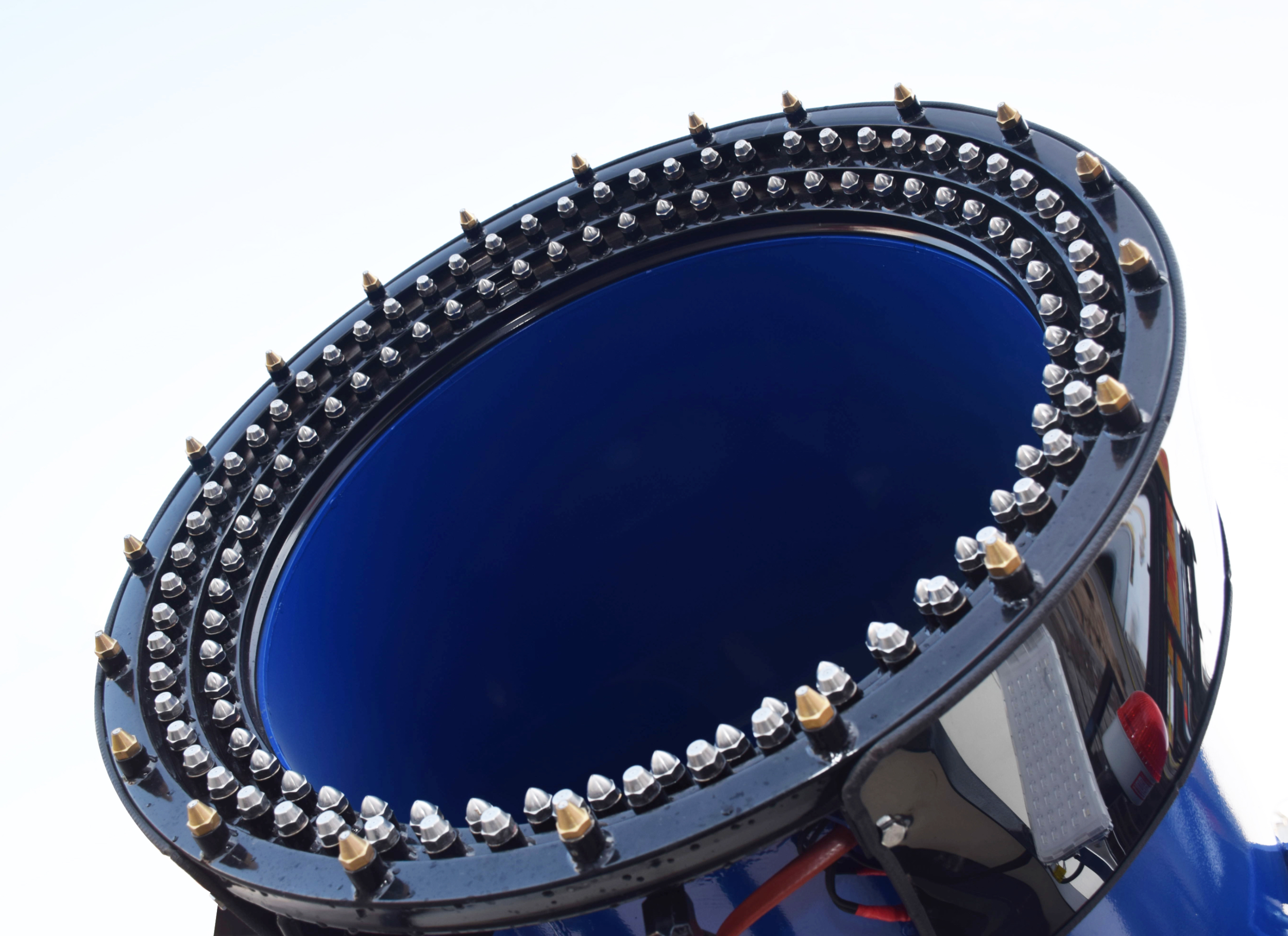 Snow cannon nozzle close-up showing precision atomization spray detail