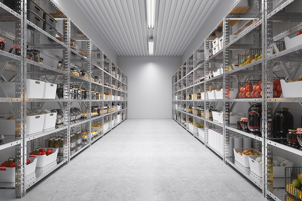 Hygienic interior of a commercial cold room with optimized shelving and LED lighting for organized inventory management.