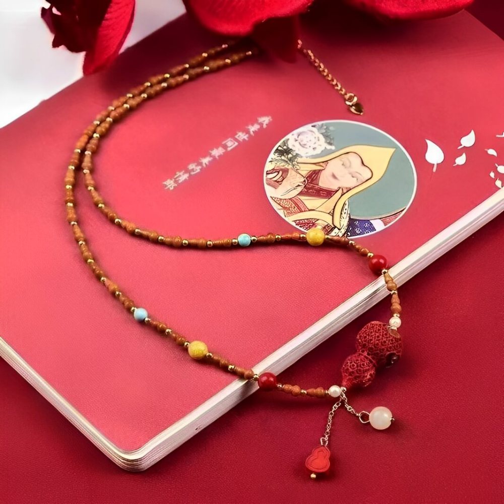 Cinnabar Painted Peaceful Gourd Olive Kernel Necklace