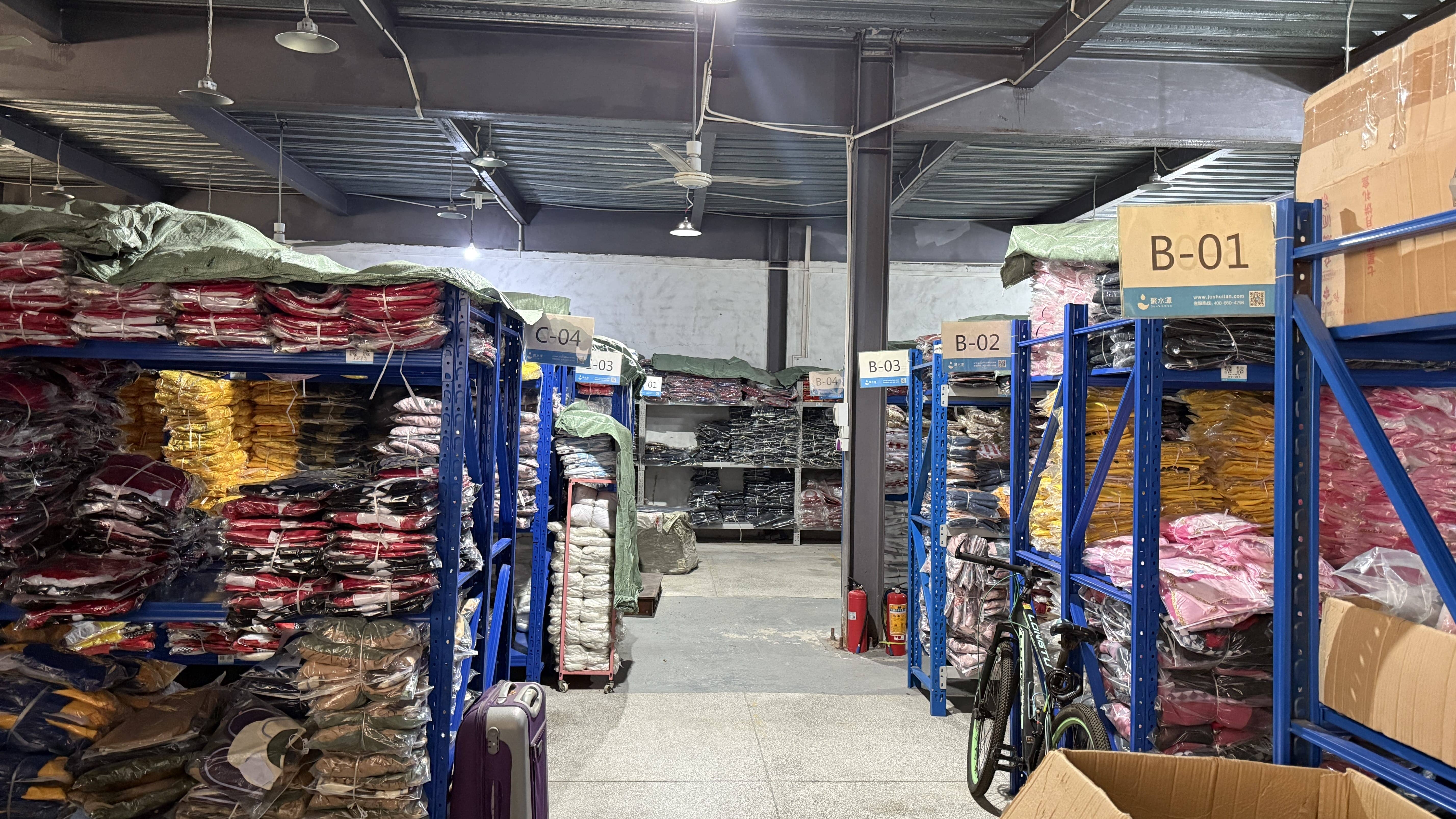 Costume warehouse with organized shelves and large ready-to-ship inventory for wholesale distribution
