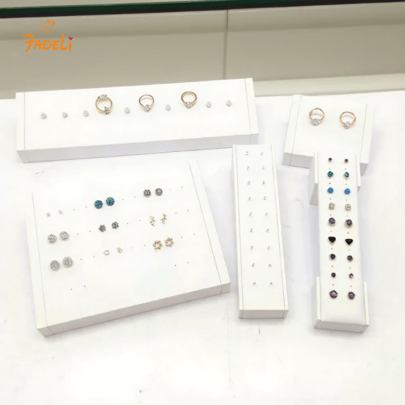 FADELI Factory Custom Piercing Jewelry Display White Pu Leather Stud Earring Display Stand with Silkscreen Gold logo Ring Display