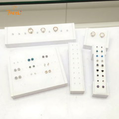 FADELI Factory Custom Piercing Jewelry Display White Pu Leather Stud Earring Display Stand with Silkscreen Gold logo Ring Display