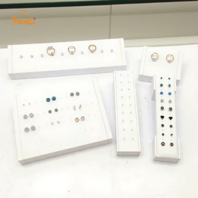 FADELI Factory Custom Piercing Jewelry Display White Pu Leather Stud Earring Display Stand with Silkscreen Gold logo Ring Display