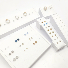 FADELI Factory Custom Piercing Jewelry Display White Pu Leather Stud Earring Display Stand with Silkscreen Gold logo Ring Display