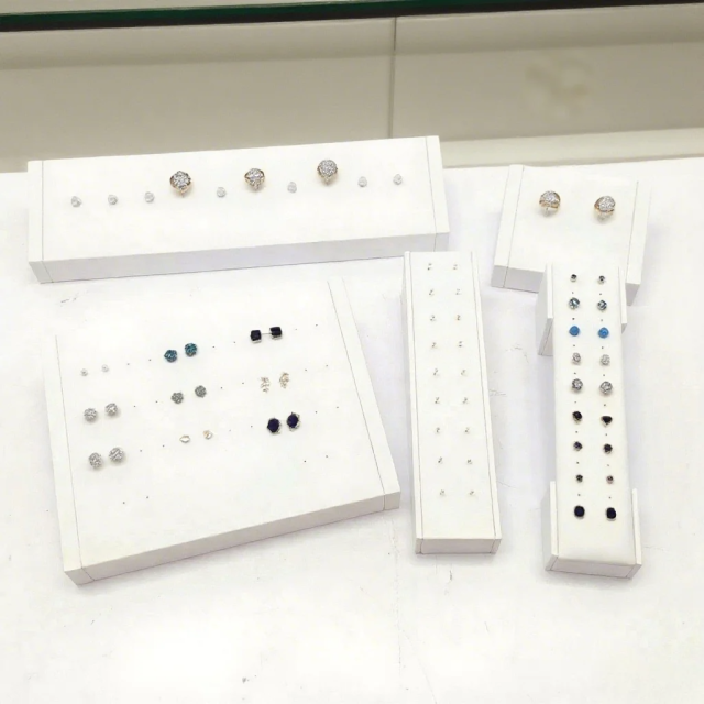 FADELI Factory Custom Piercing Jewelry Display White Pu Leather Stud Earring Display Stand with Silkscreen Gold logo Ring Display