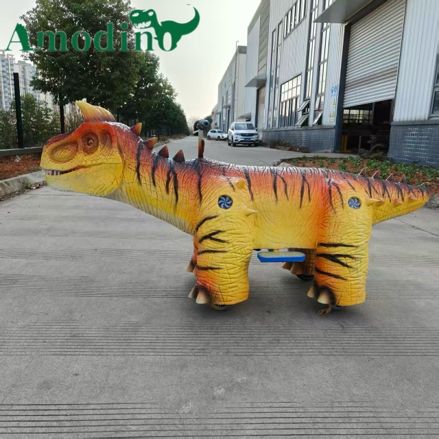 Custom Orange Striped Carnotaurus Kiddie Ride | Commercial Dinosaur Ride Manufacturer