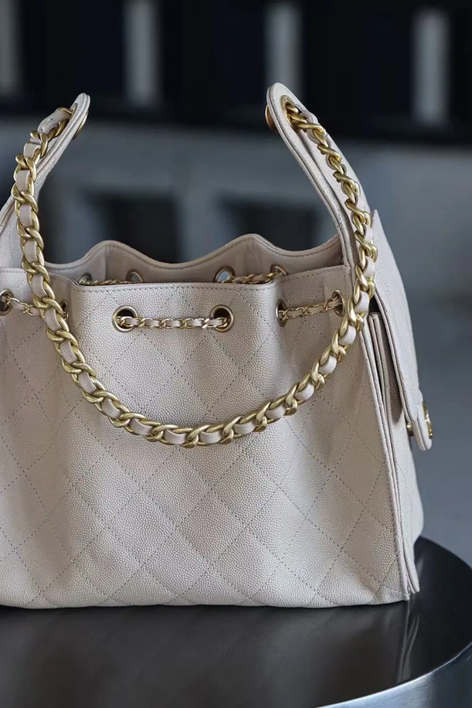 The Chanel 25 Hand Gag
