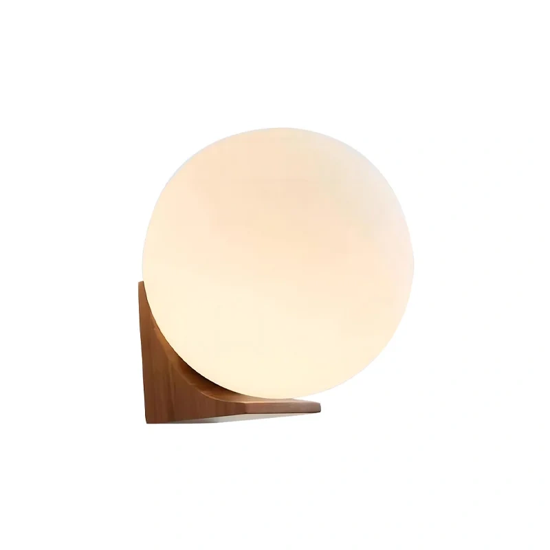 round glass shade on wooden wall lamp