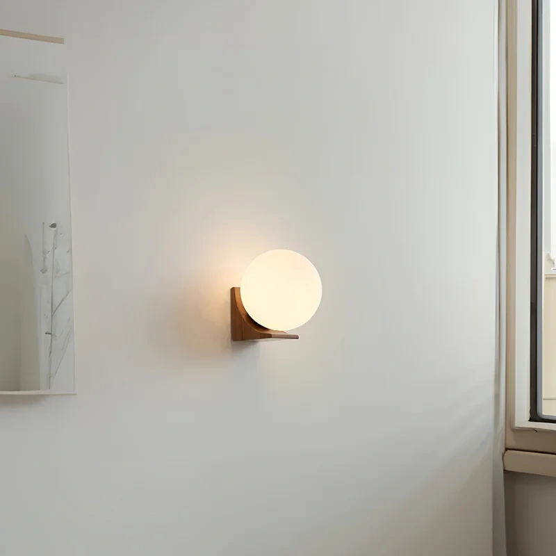 walnut wood wall sconce with glass shade