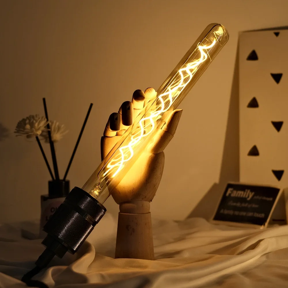 Illuminated E27 long tube filament bulb in an angled lamp holder