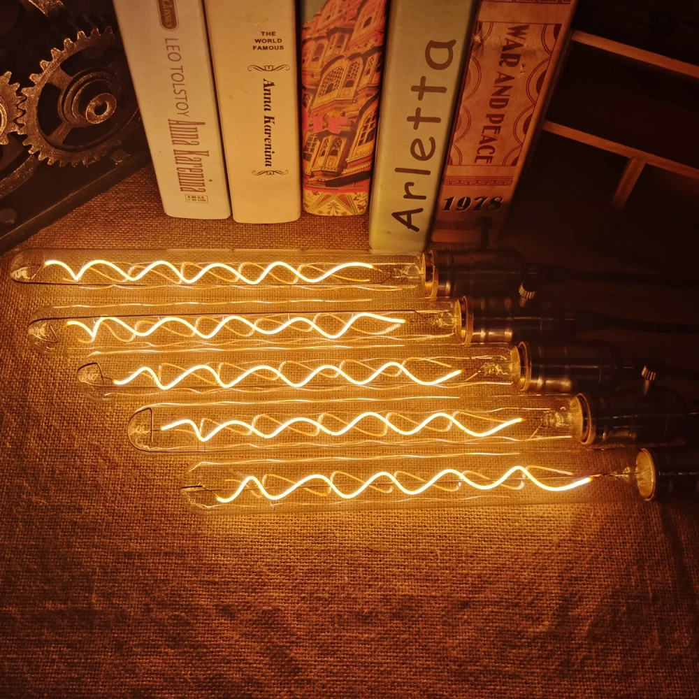 Decorative tubular LED bulbs arranged horizontally with filaments illuminated