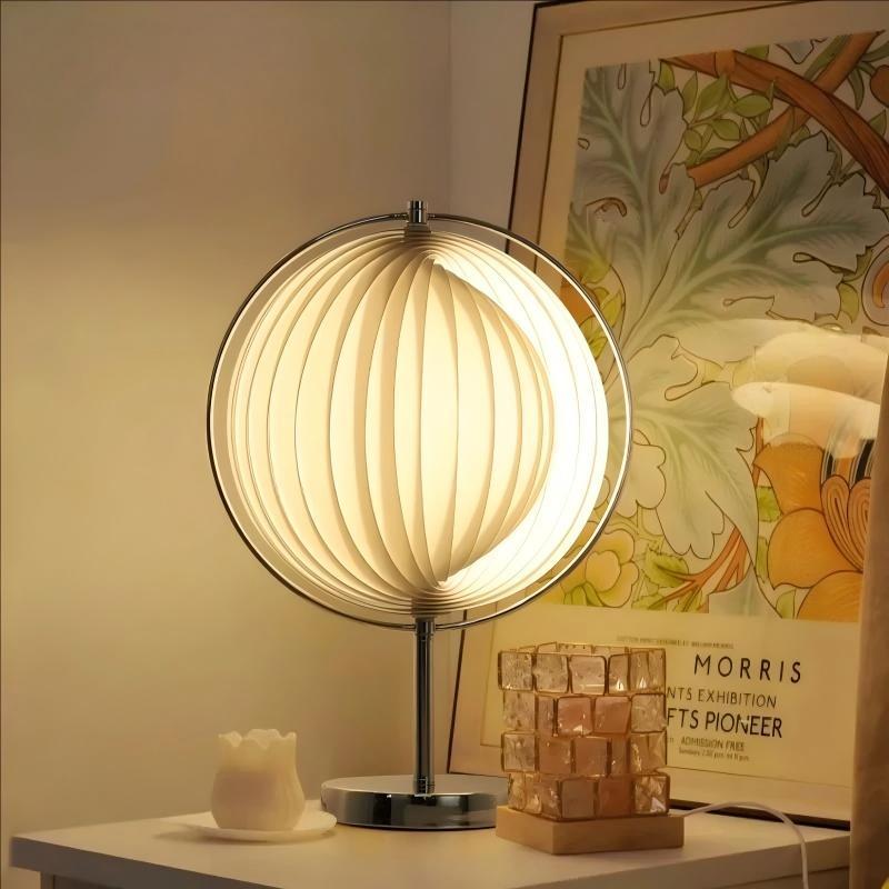 Modern moon shaped floor lamp beside a living room sofa