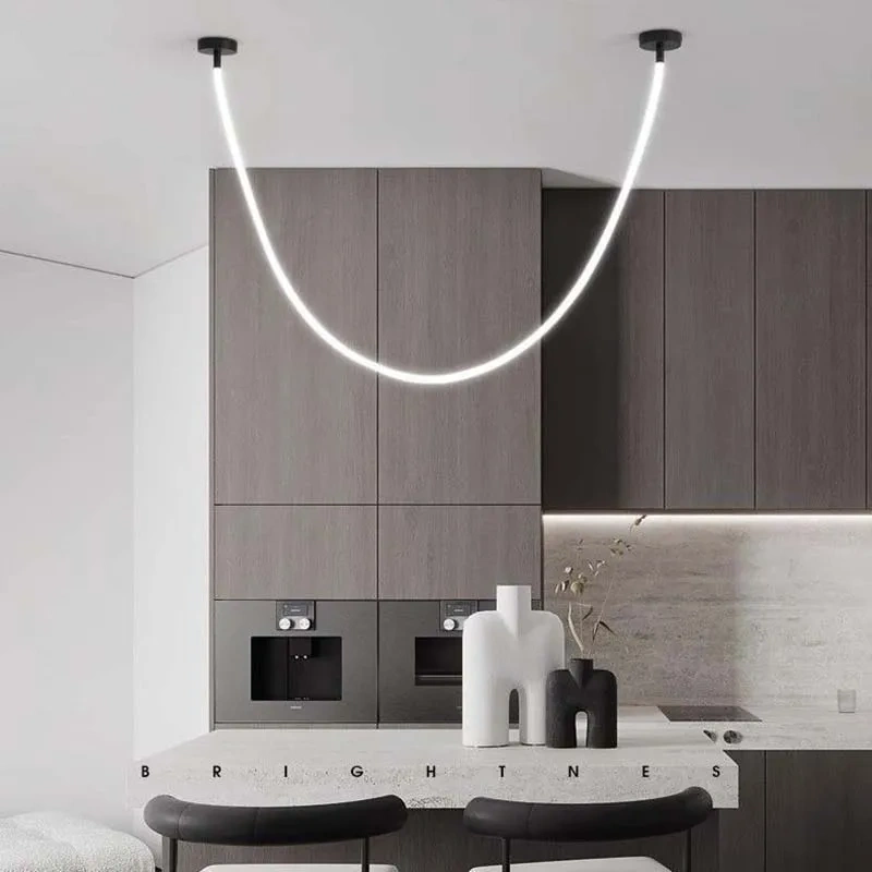 Long silicone LED pendant light above dining table