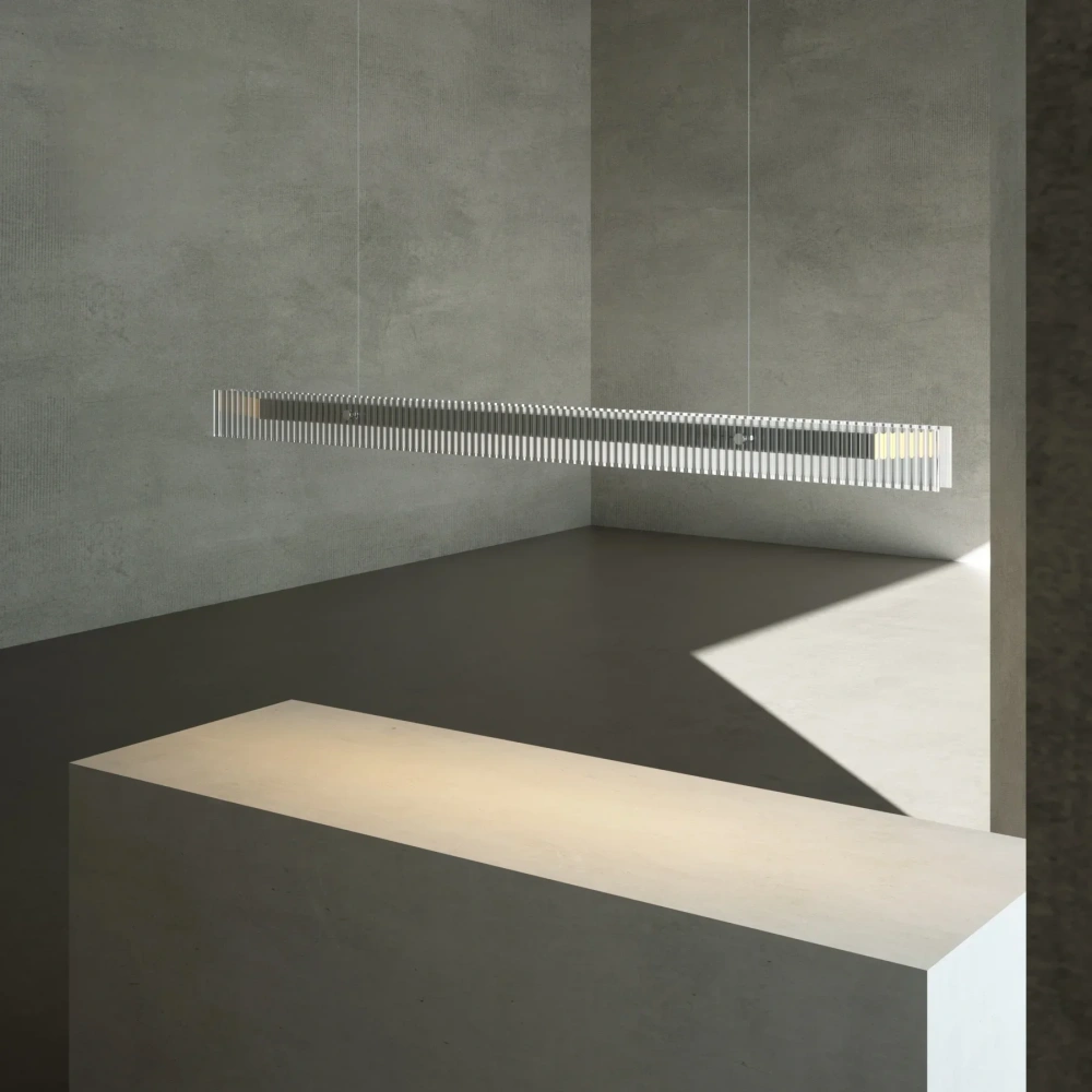 Minimalist LED linear pendant lamp hanging over a wooden dining table