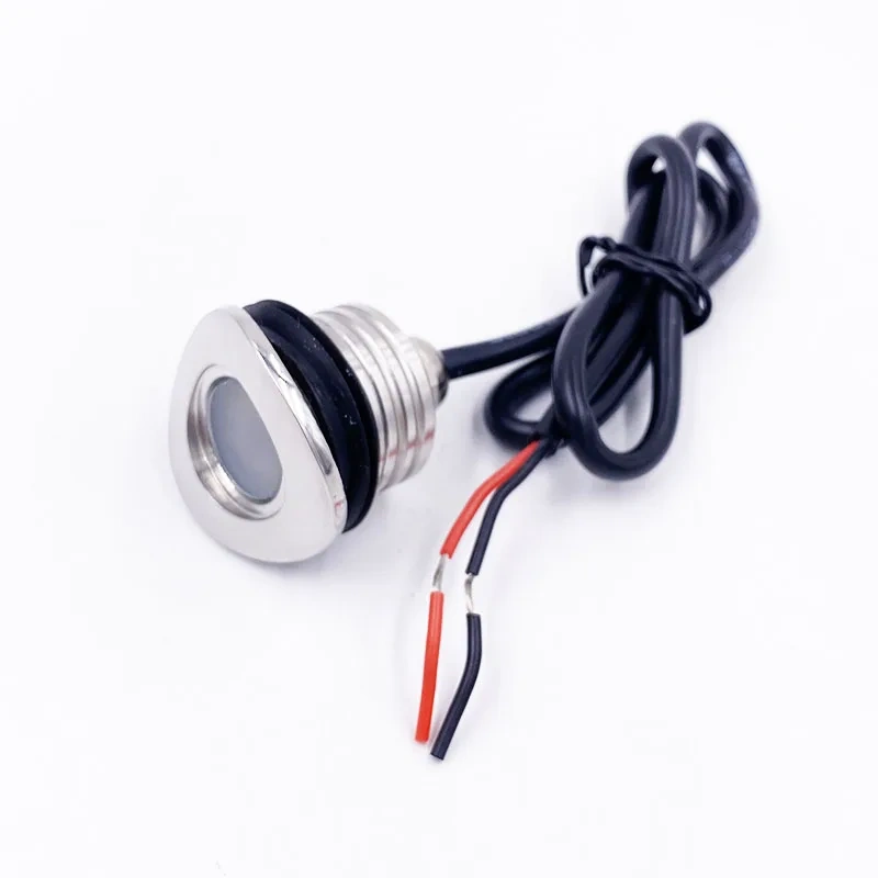 Mini LED railing light with recessed body and red and black connection wires