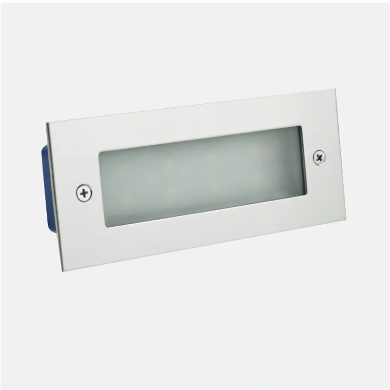 Recessed LED step light with a frosted panel and silver-colored frame