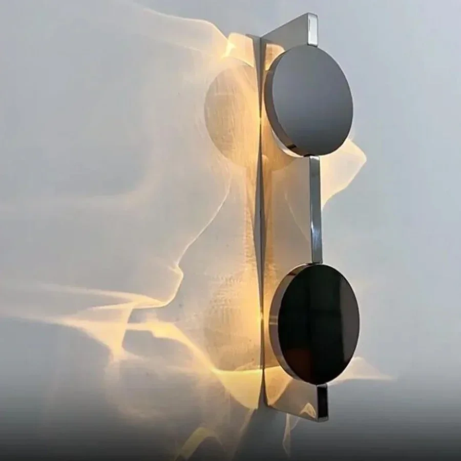 Side view of a chrome double-head LED wall light with warm illumination