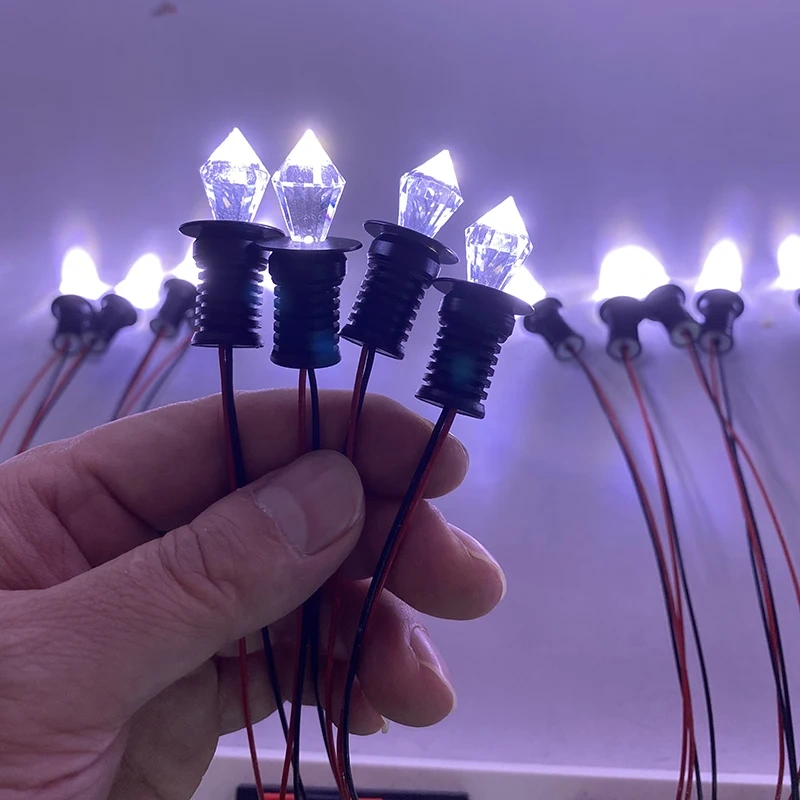 Spring-clip mounting of a mini LED spotlight in a 13mm cutout