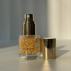Bulk Golden Caviar Essence single unit—transparent glass bottle with golden press pump & cap, featuring golden beaded texture, suitable for B2B beauty supply & OEM skincare orders