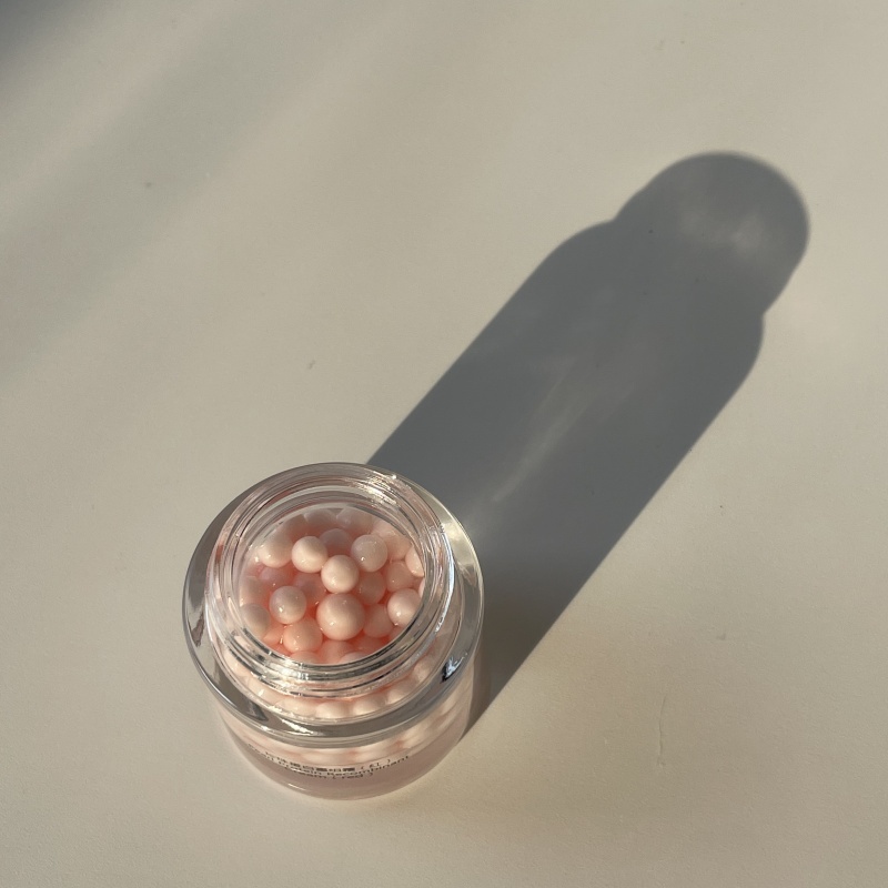 Open jar of red Pearl Protein Recombinant Cream (top view)—pink beaded skincare cream in transparent glass jar, applicable for private label skincare & B2B wholesale procurement