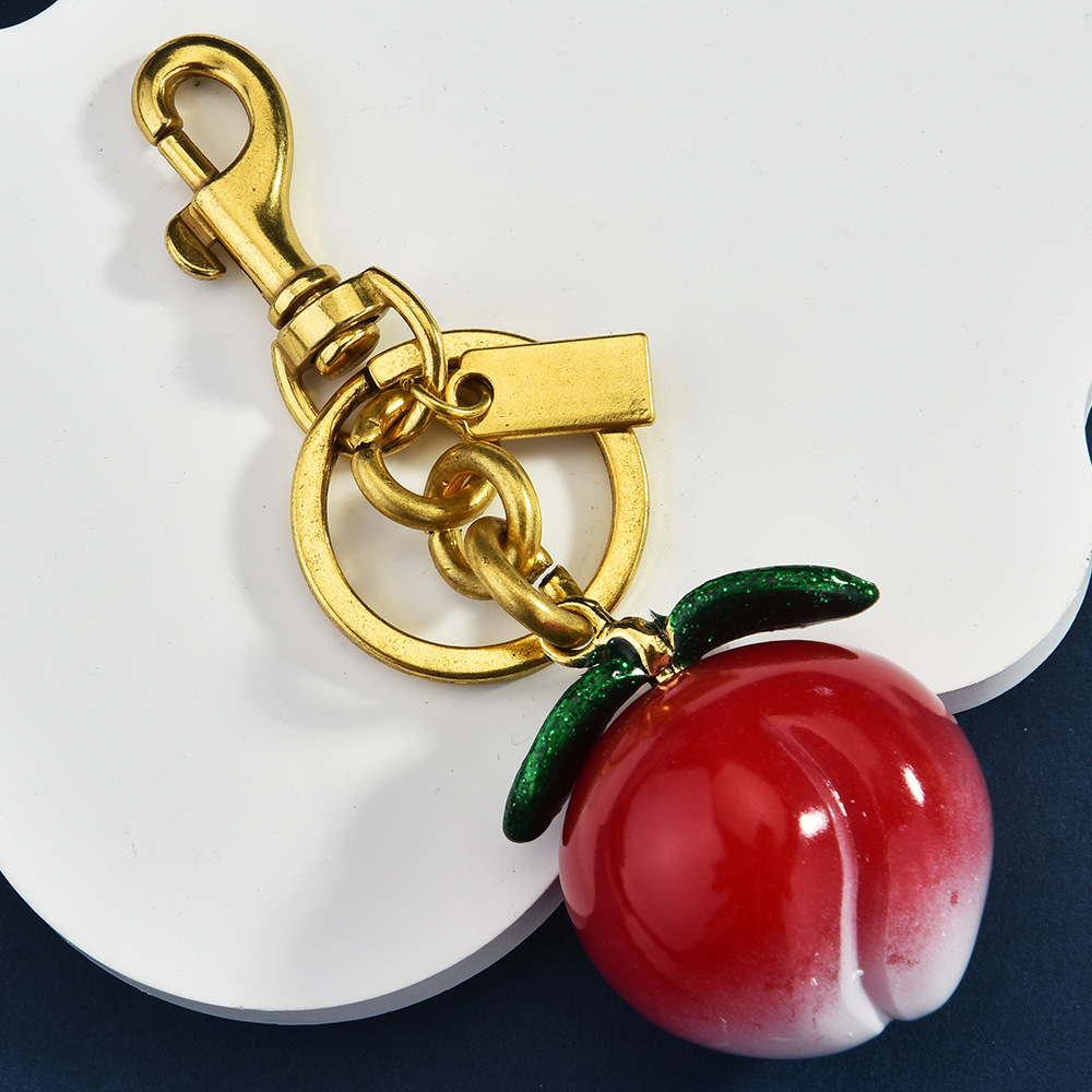 Simulated peach keychain, creative fruit-shaped bag pendant, cute pendant gift