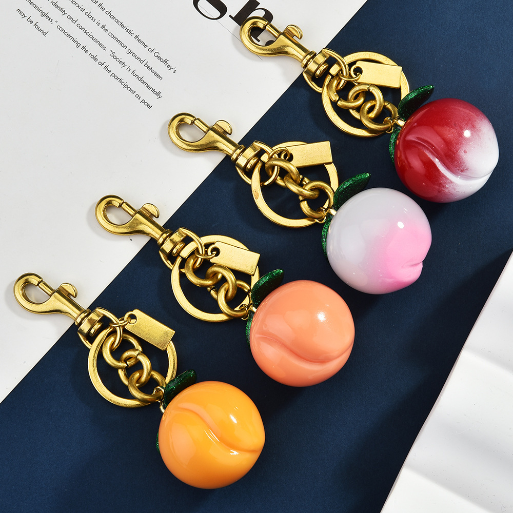 Simulated peach keychain, creative fruit-shaped bag pendant, cute pendant gift