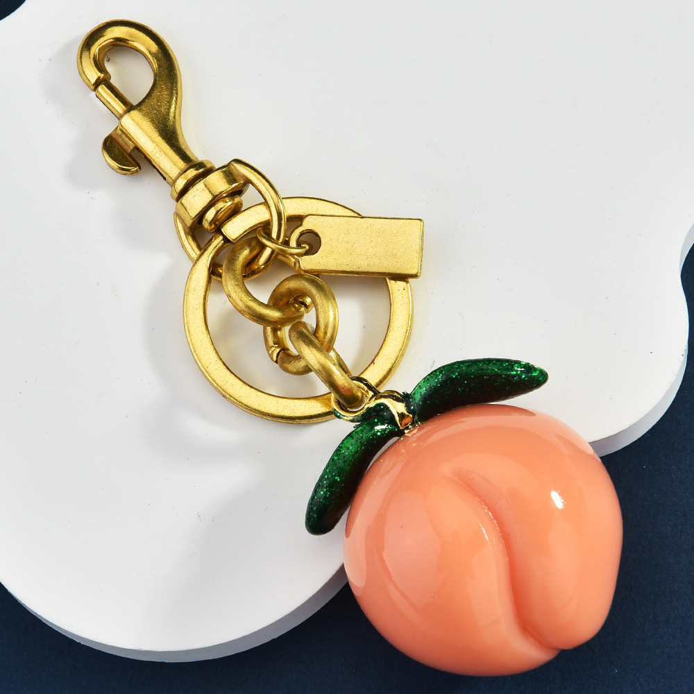Simulated peach keychain, creative fruit-shaped bag pendant, cute pendant gift