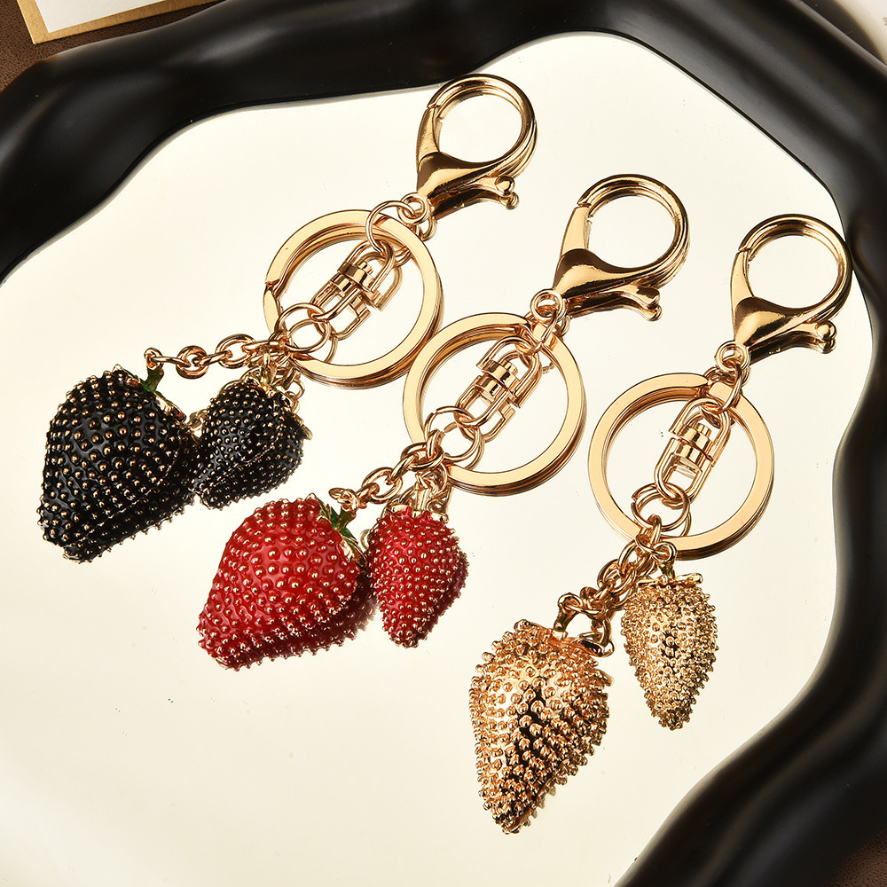 Diamond-encrusted strawberry keychain | Wrap the "Sweet Cool Strawberry" in a hanging bag
