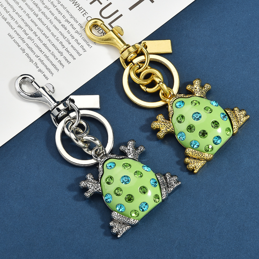 Diamond-encrusted frog keychain | Put the "Fun Little Lucky" hanging bag on it