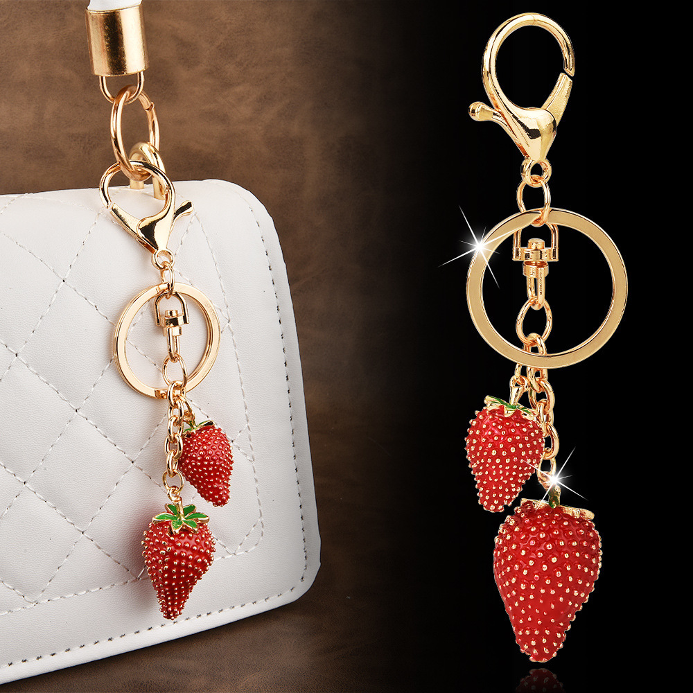 Diamond-encrusted strawberry keychain | Wrap the "Sweet Cool Strawberry" in a hanging bag