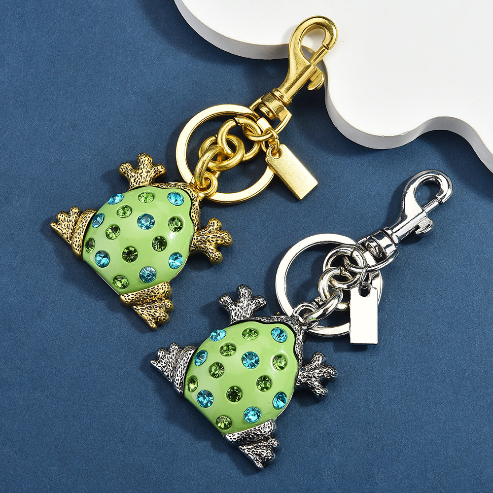 Diamond-encrusted frog keychain | Put the "Fun Little Lucky" hanging bag on it