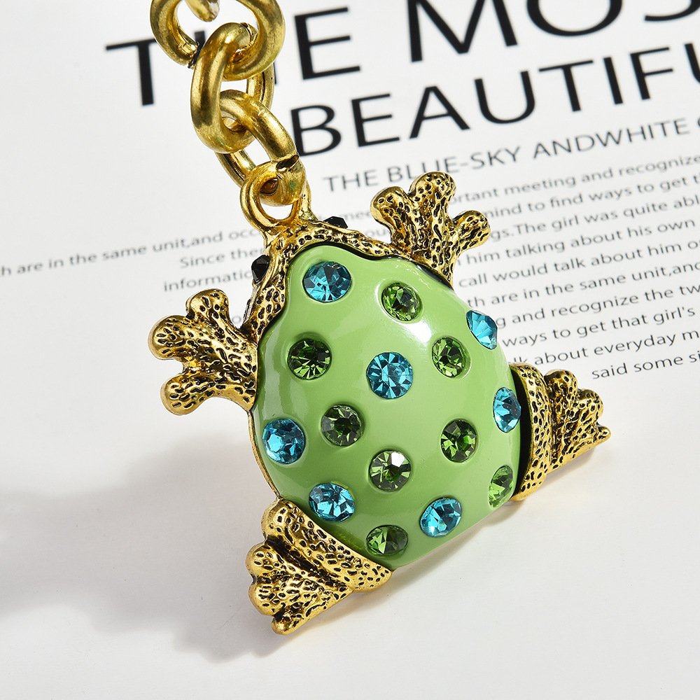 Diamond-encrusted frog keychain | Put the "Fun Little Lucky" hanging bag on it