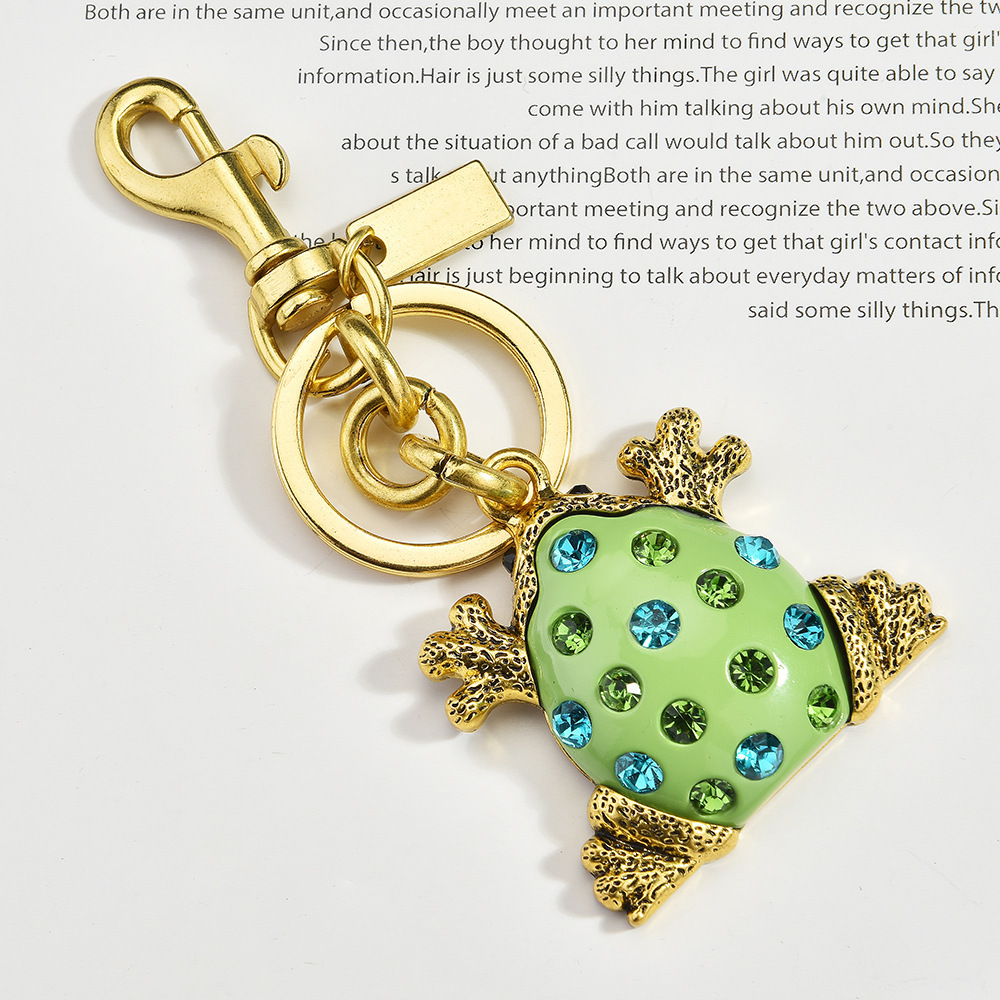 Diamond-encrusted frog keychain | Put the "Fun Little Lucky" hanging bag on it