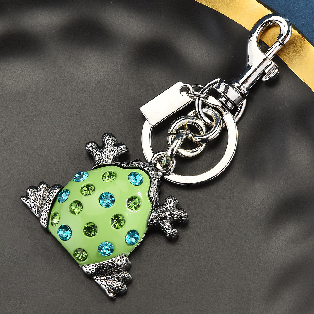 Diamond-encrusted frog keychain | Put the "Fun Little Lucky" hanging bag on it
