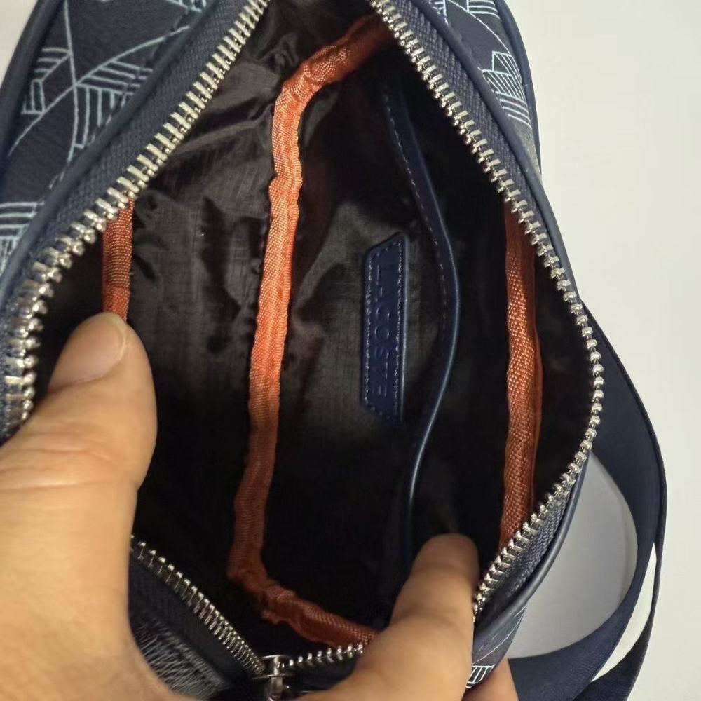 LACOSTE Textured geometric print crossbody bag for a high-end fashion look.