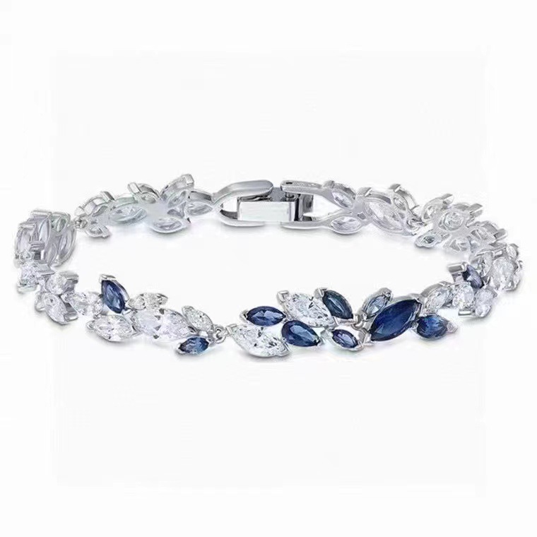 Elegant blue and white gemstone bracelet Luxurious flower and leaf shaped accessories