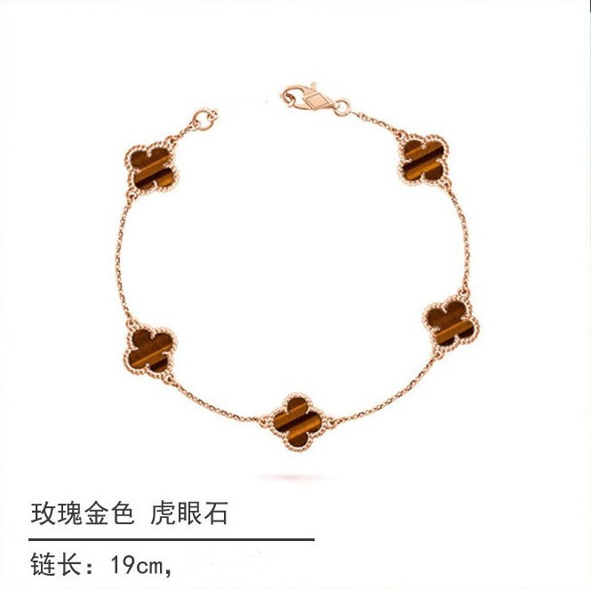 White gold and black onyx diamond four-leaf clover bracelet