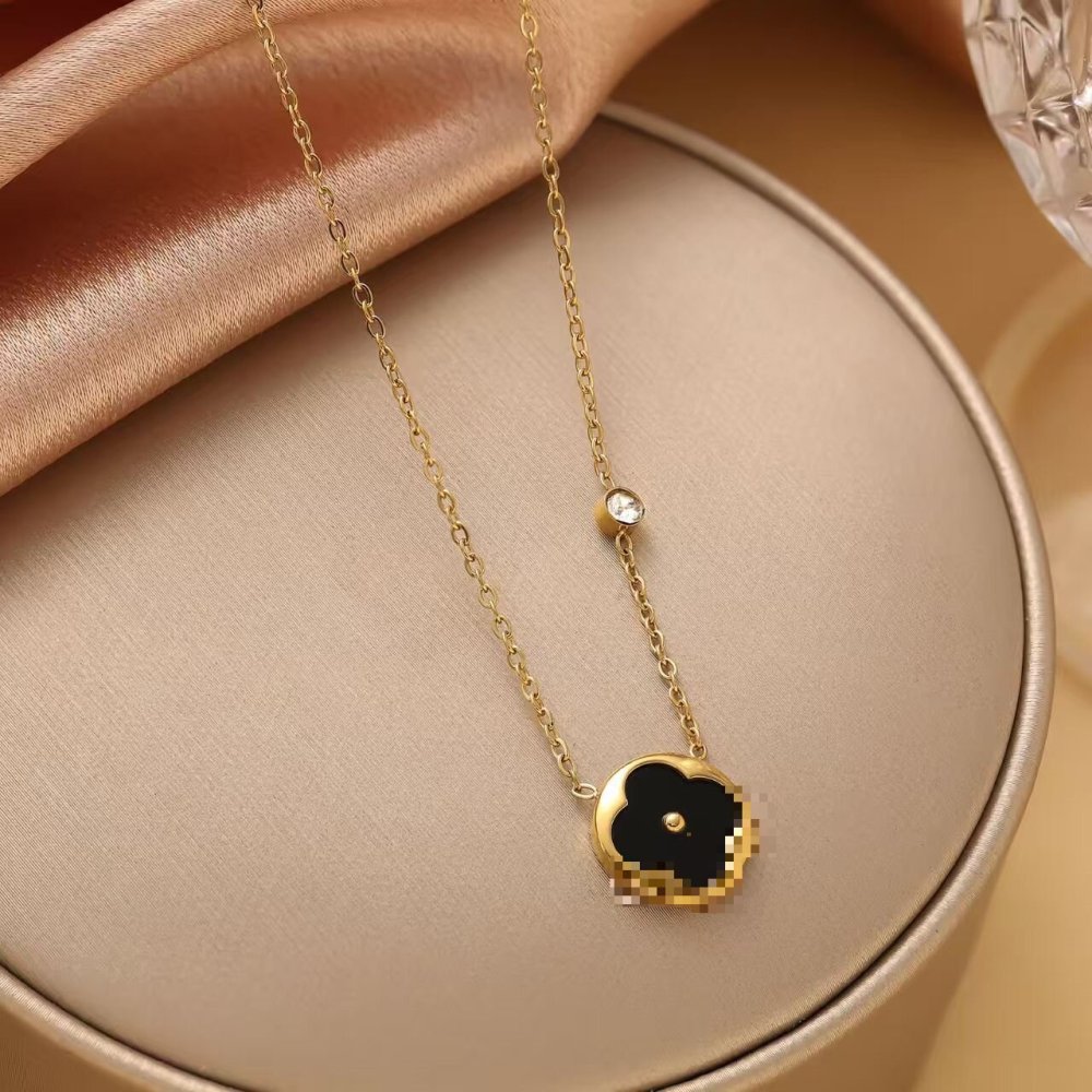 Diamond-encrusted four-leaf clover necklace