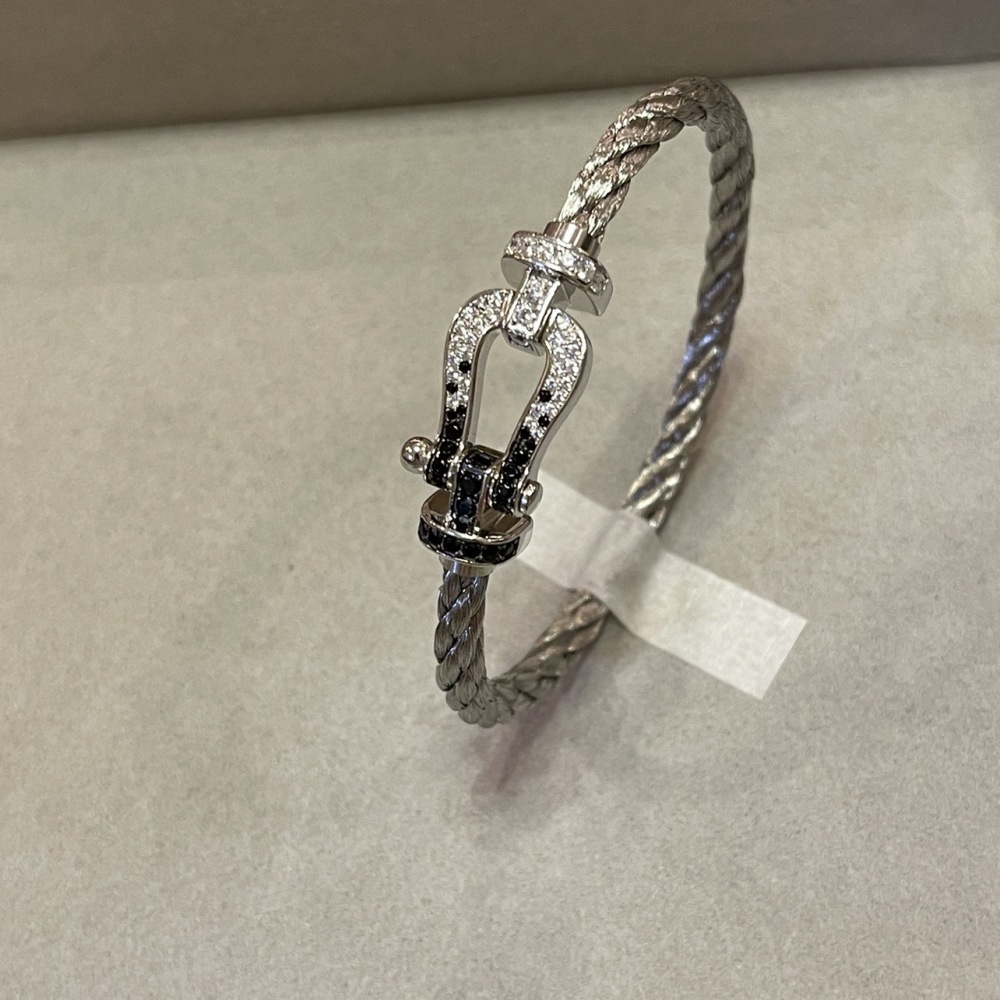 Diamond-encrusted braided leather cord bracelet