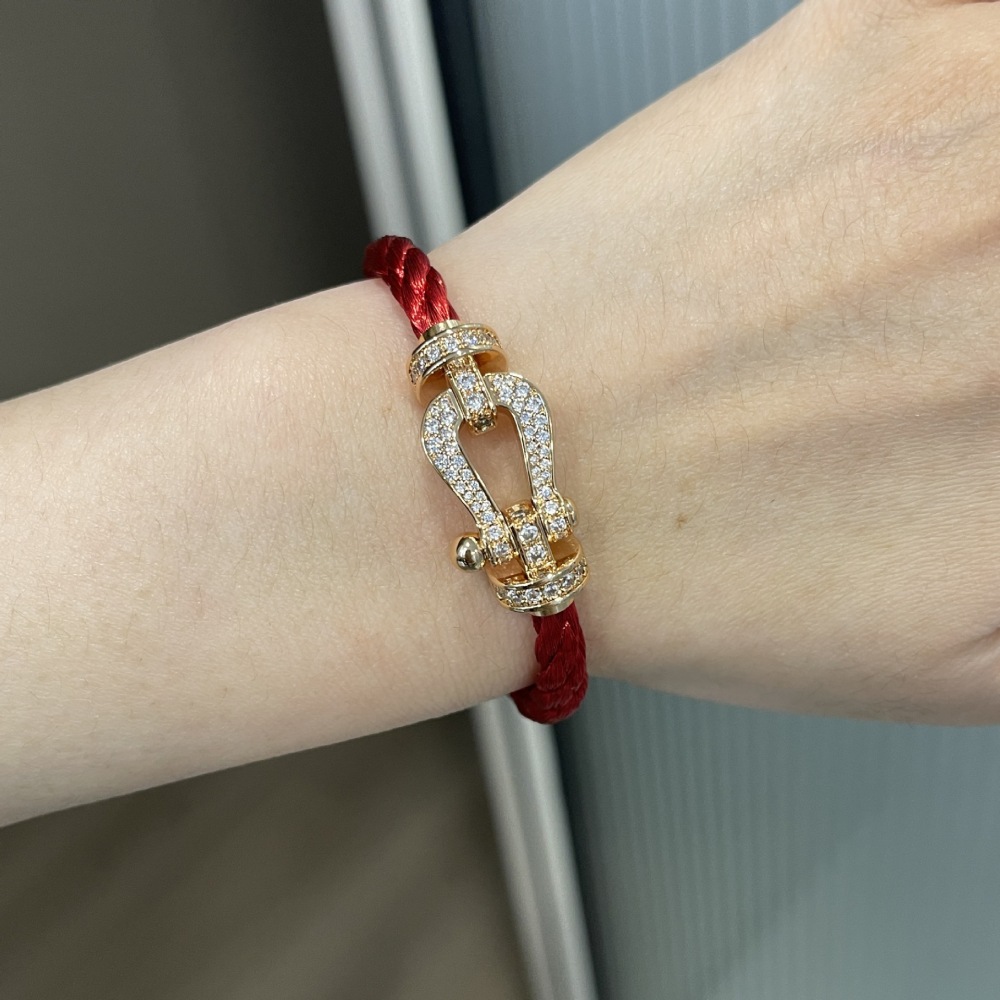 Diamond-encrusted braided leather cord bracelet