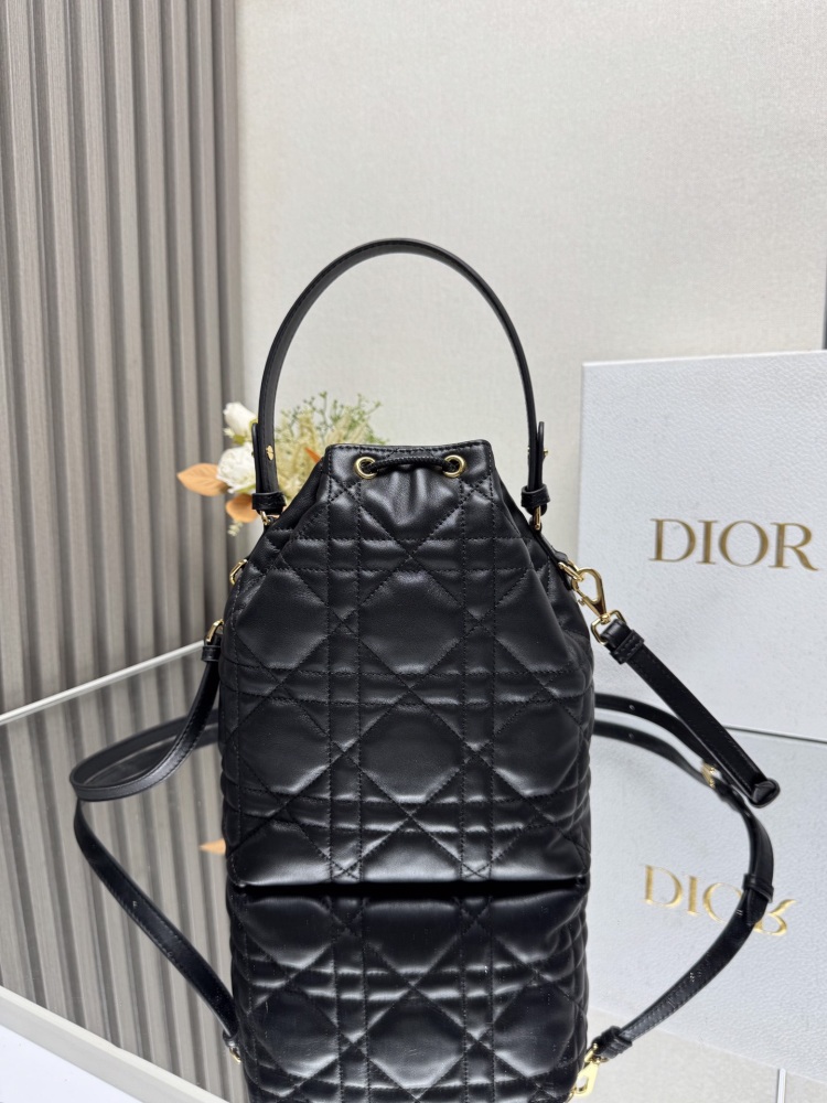 Dior M3372 is a Dior Caro bucket bag made of carefully crafted materials such as black sheepskin leather, adorned with oversized wicker patterned stitching and spacious drawstring compartments