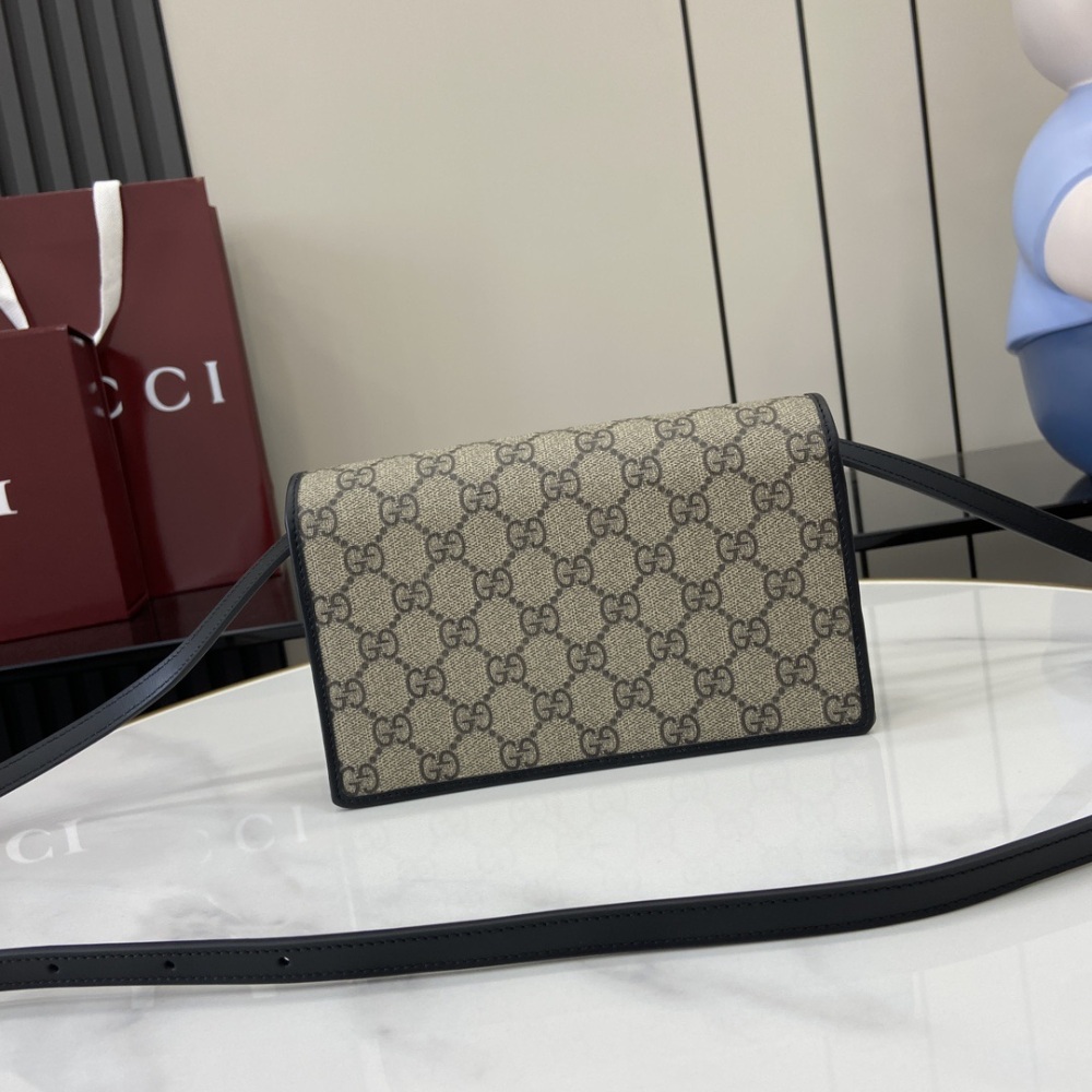 Gucci's Emblem Series Ultra Mini Shoulder Backpack: This beige and dark brown ultra mini shoulder backpack is a new interpretation of the brand's new small accessory series